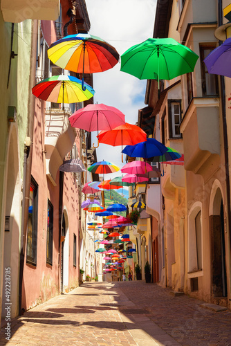 Colored umbrellas decorates alley in old town in Chiusa Italy © woloha79