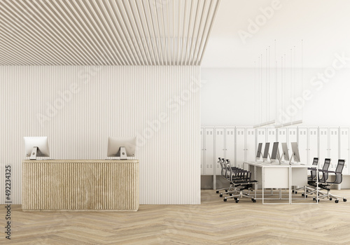 Fototapeta Naklejka Na Ścianę i Meble -  Front view of a white wood reception desk with laptops standing on it in front of a modern office wall. wooden slats wall and ceiling and meeting room on parquet floor and pendant 3d rendering mock up