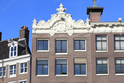 Amsterdam Keizersgracht Canal Building Facade with Sculpted Roof Detail, Netherlands