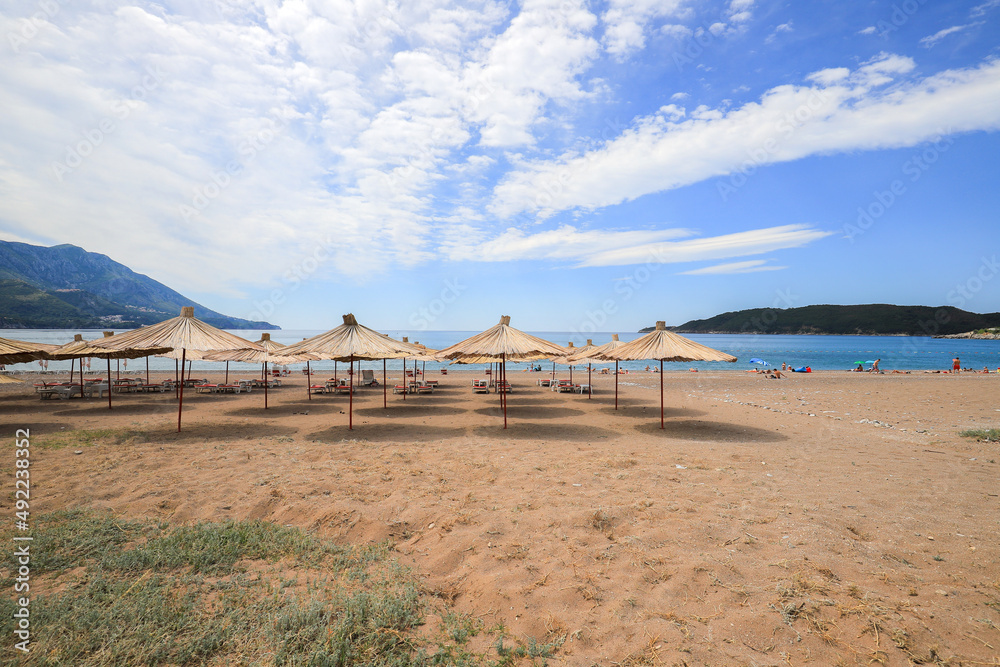 Beautiful beach with sunshades in Montenegro Beautiful beach with sunshades in Montenegro