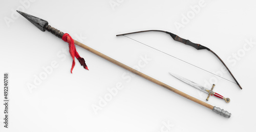 spear and bow isolated on white background photo