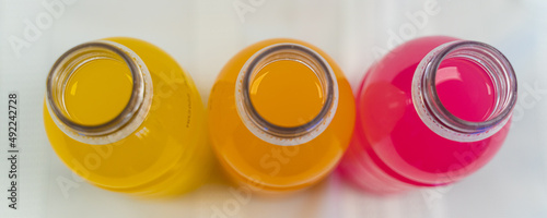 Multi colored Energy sport drink bottles with different flavours photo