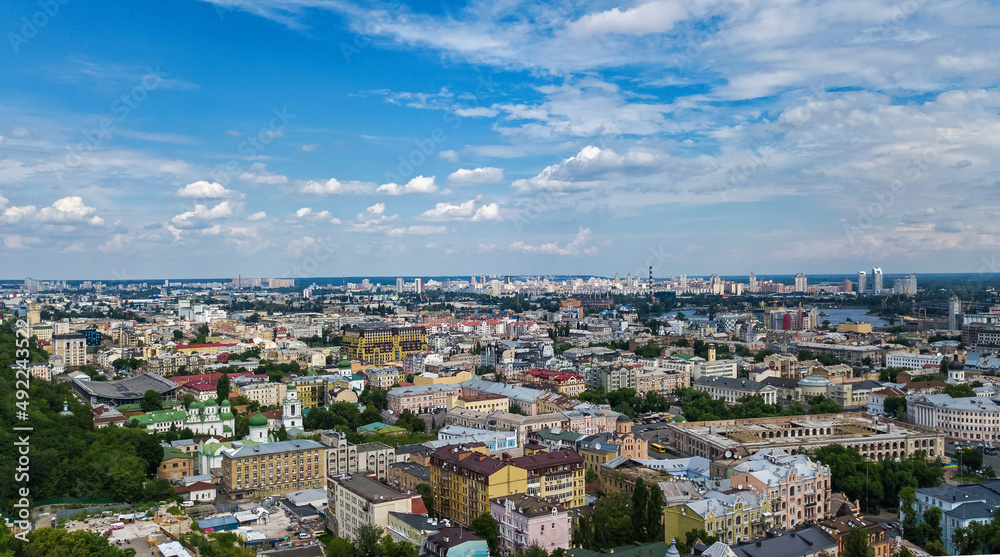 Kyiv cityscape aerial drone view, Dnipro river, downtown and Podol historical district skyline from above, city of Kiev and Dnieper, Ukraine