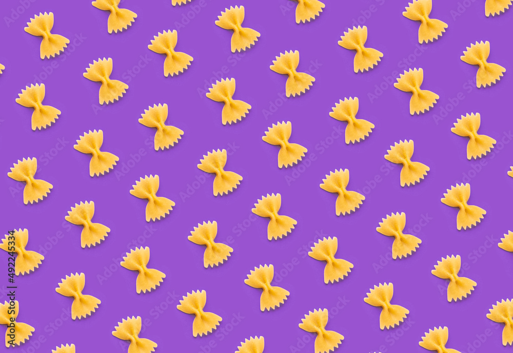 Butterfly farfalle pasta pattern on purple background. Butterfly farfalle pasta pattern on purple background.