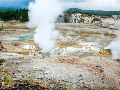 Billows of steam fume from geothermal features in the Norris Geyser Basin of Yellowstone National Park, Wyoming, USA. photo