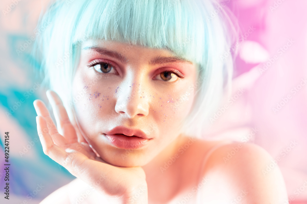 Modern sensual blond european woman with short hair, perfect skin,  contemporary makeup and glitter on face. Girl opened plump lips looking at  camera. Ad for youth and teen skincare cosmetics Photos