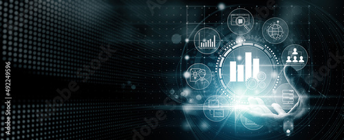 Obraz na płótnie Business hand Worker holding Business analytics Big data analysis technology future concept on VR screen on blur background. w salonie