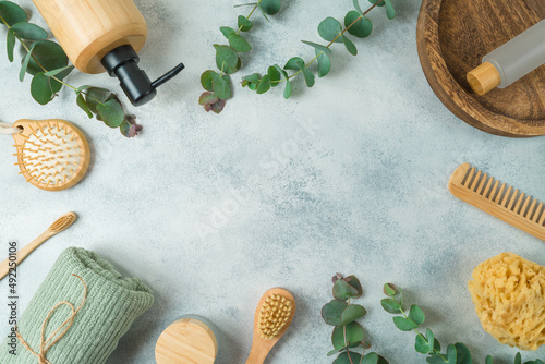 Konstfotografi Frame border design with body care products and  eucalyptus leaves on gray concrete background
