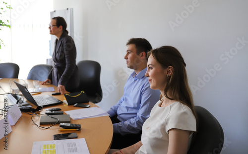 Confident business man and women in a business meeting
