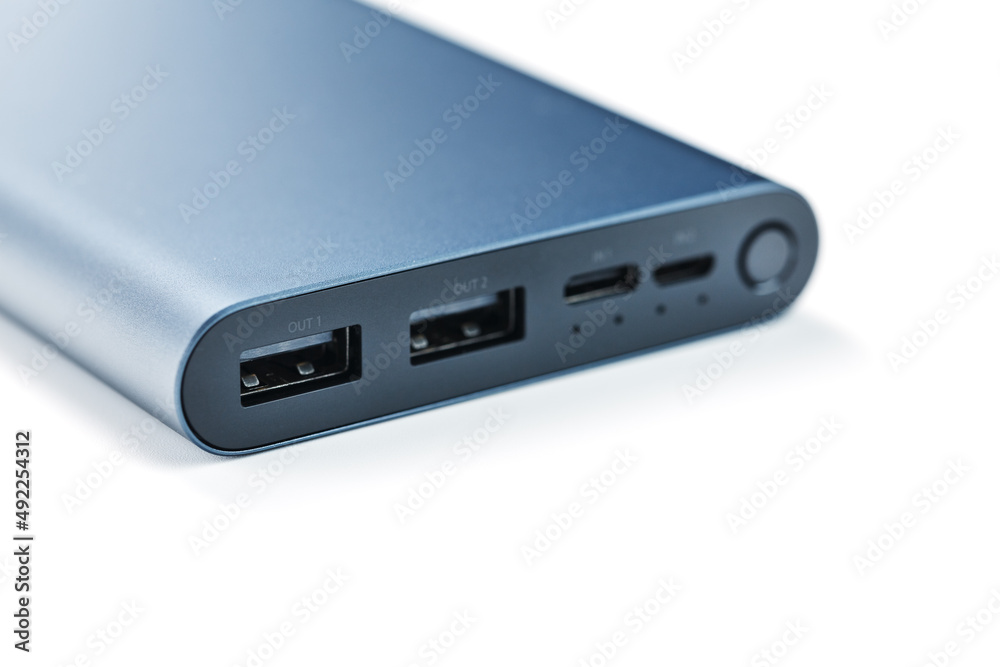 Blue Power Bank for charging mobile devices isolated on white background Blue Power Bank for charging mobile devices isolated on white background