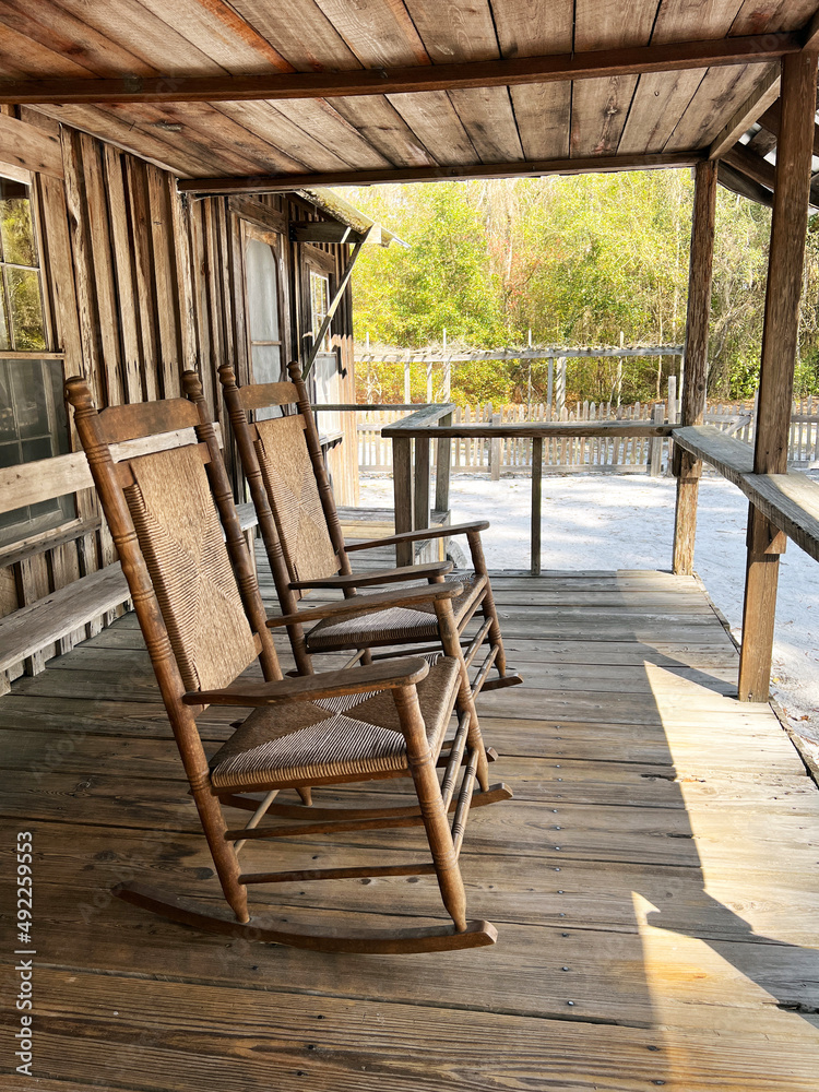 Rocking chairs on a deck.