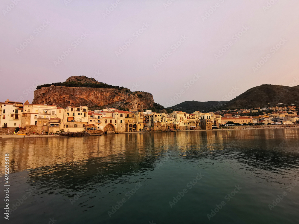 Sunset in the bay of Cefalu, Sicily, Italy, Europe.