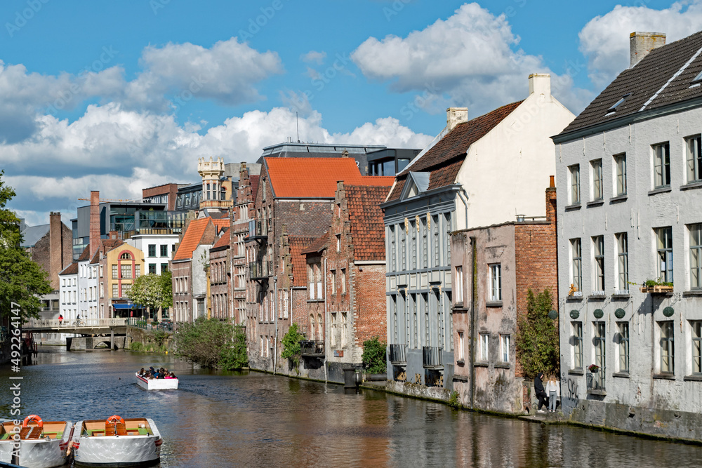 Apartment buildings line a canal in Ghent, Belgium.