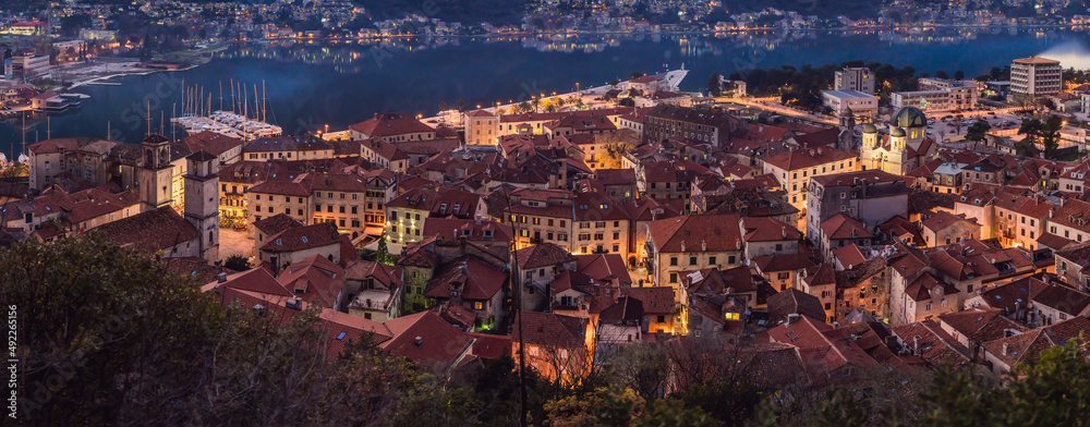 Old city. Kotor. Montenegro. Narrow streets and old houses of Kotor at sunset. View of Kotor from the city wall. View from above