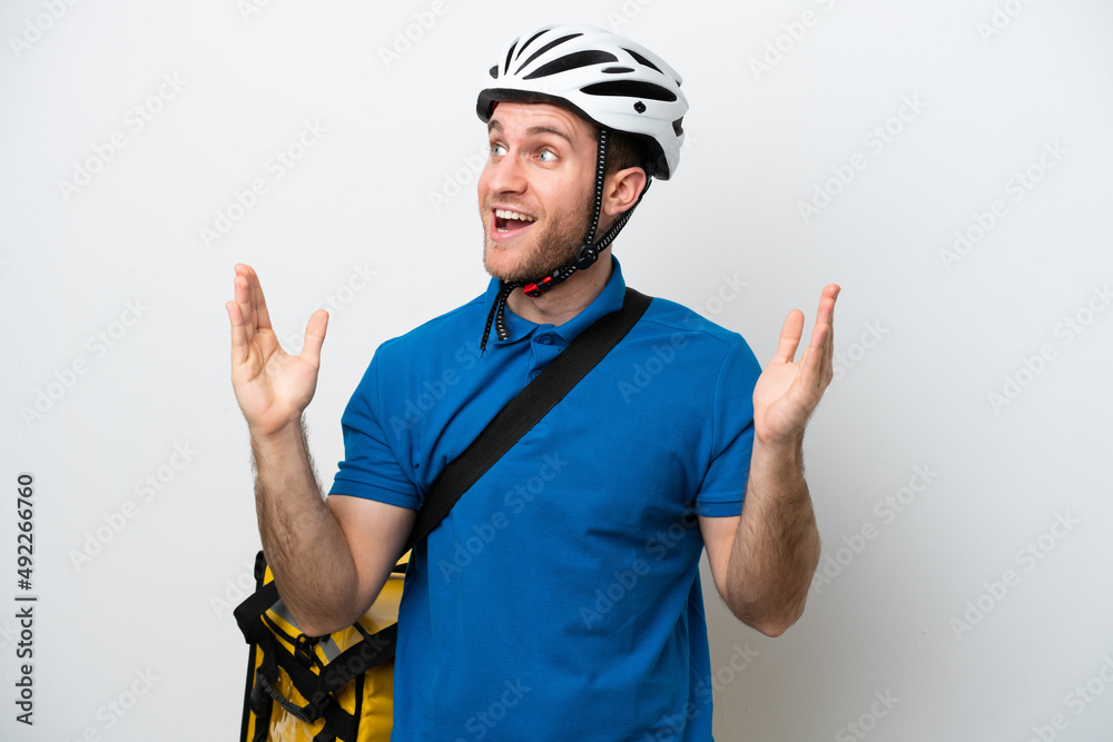 Young caucasian man with thermal backpack isolated on white background with surprise facial expression Young caucasian man with thermal backpack isolated on white background with surprise facial expression