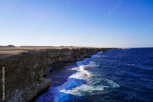 Deep blue sea waves hit cliffs in the Red Sea, Hurgharda, Egypt