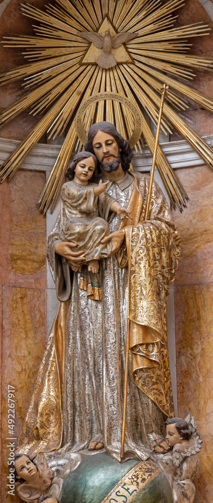 VALENCIA, SPAIN - FEBRUAR 14, 2022: The carved polychrome statue of St. Joseph in the Cathedral - Basilica of the Assumption of Our Lady by José Ponsoda (1882-1963).