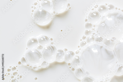 macro milk texture,White surface of milk and bubbles and ripples from above birds eye view