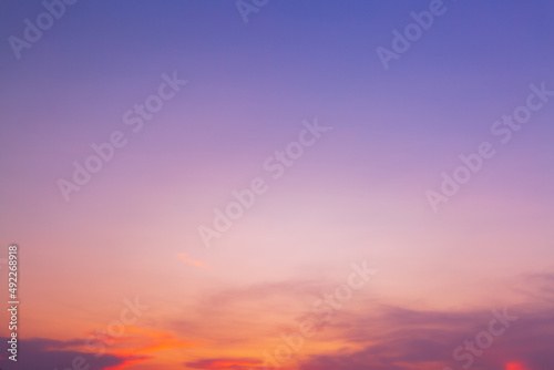 clouds and sky in the evening,Beautiful sky painted by the sun leaving bright golden shades.Dense clouds in twilight sky in winter evening.Image of cloud sky on evening time.Evening sky scene with © banjongseal324