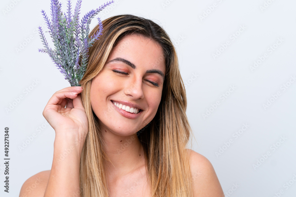 Young caucasian woman isolated on white background holding a lavender plant. Close up portrait Young caucasian woman isolated on white background holding a lavender plant. Close up portrait