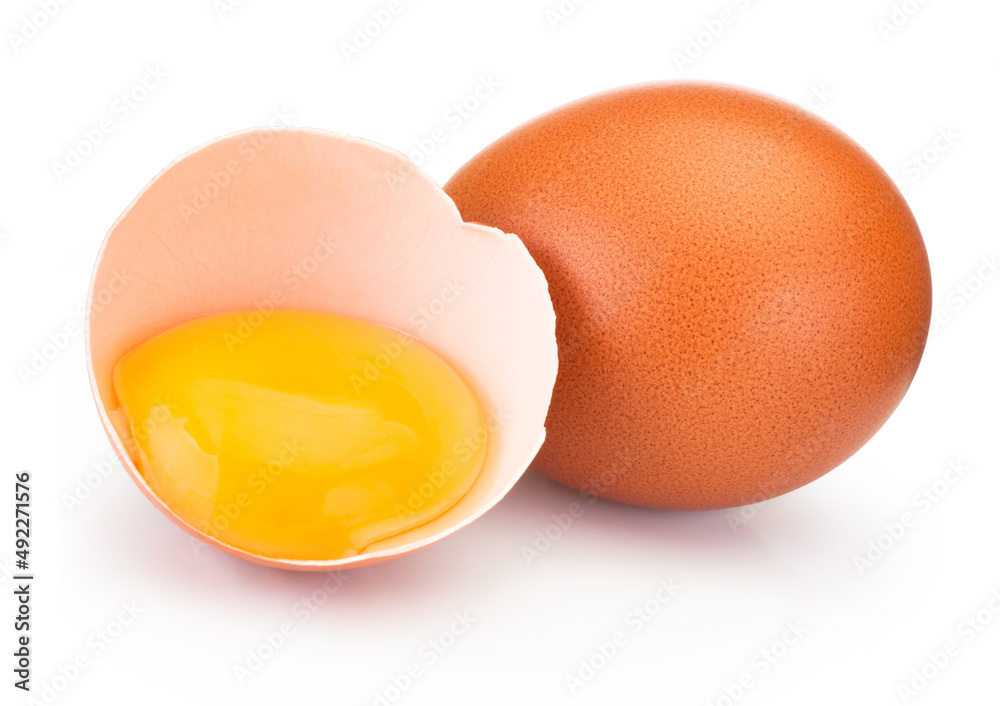 Broken brown egg in eggshell half isolated on white background Broken brown egg in eggshell half isolated on white background