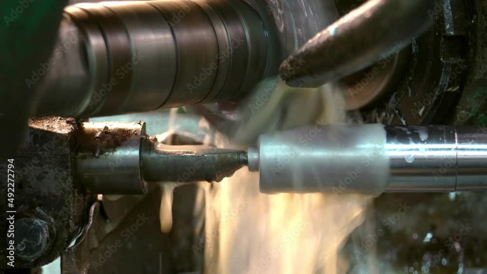 An industrial lathe processes metal. Tool manufacturing. Production of drills. An industrial lathe processes metal. Tool manufacturing. Production of drills.