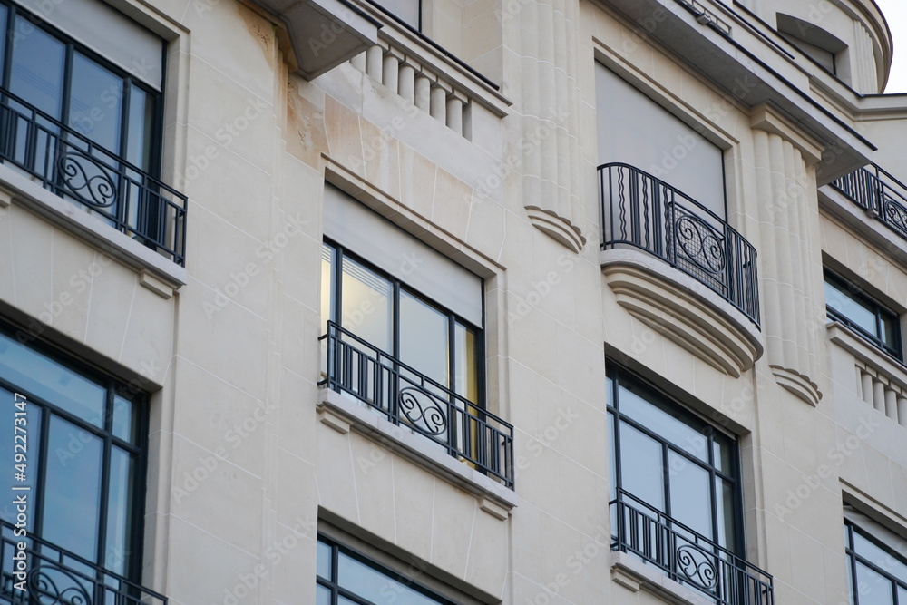 Beautiful facade of a building from Paris, France, with a lot of plants and elegant architecture details and decorations. Beautiful facade of a building from Paris, France, with a lot of plants and elegant architecture details and decorations.
