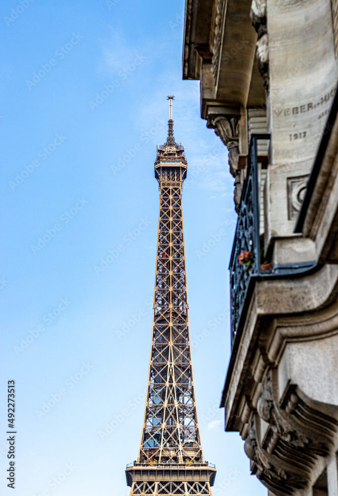 Eiffel Tower looking through buildings in Paris, France Eiffel Tower looking through buildings in Paris, France