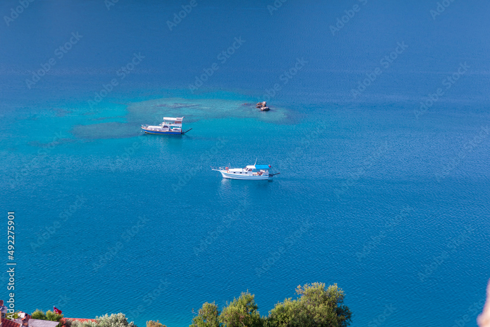 The village of Kalekoy in the centre near Kekova island in the Antalya Province of Turkey The village of Kalekoy in the centre near Kekova island in the Antalya Province of Turkey