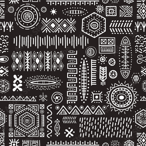 Black and white seamless background African art decoration tribal geometric shapes pattern. Pen and ink drawing of ancient ethnic traditional symbols. Hand-drawn oriental elements in doodle style.