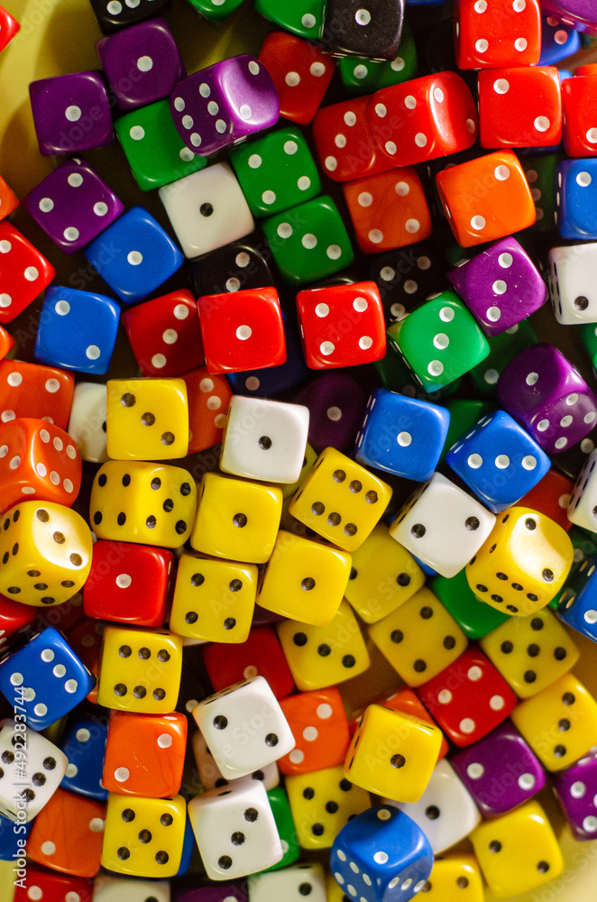 Many six-sided dice of different colors Many six-sided dice of different colors