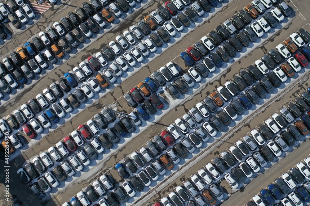 Diagonal aerial view on cars on the parking lot on a bright summer day