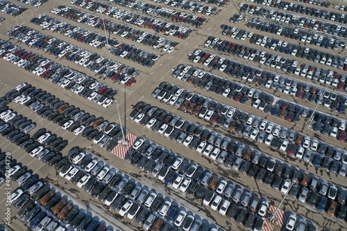 Aerial view on cars on the parking lot on a bright summer day
