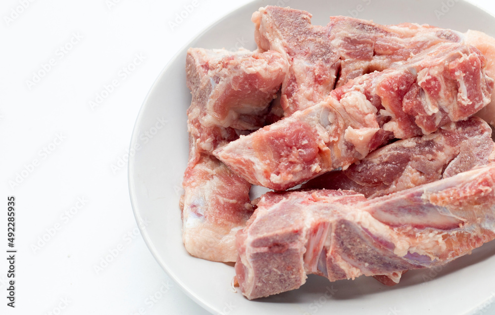 Raw pork bone on white background.