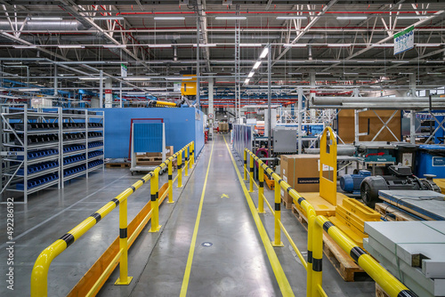 Storehouse interior with shelves and yellow pipeline