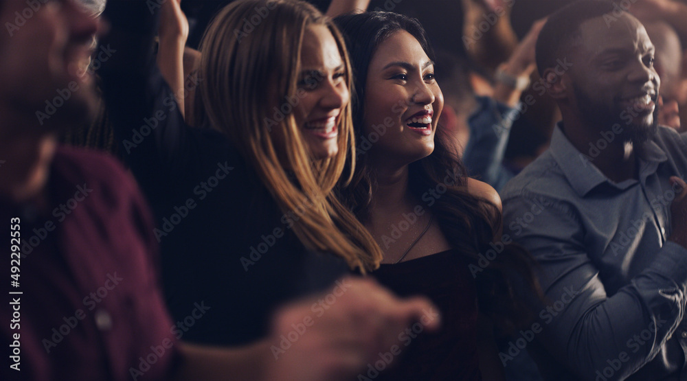 Obraz premium Theyre ready for 2020. Cropped shot of a group of young friends dancing together in a nightclub.