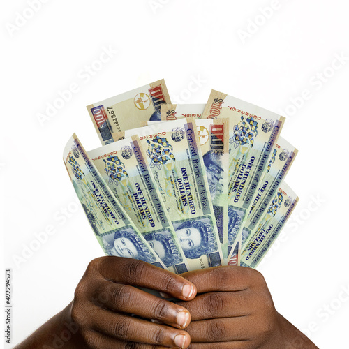 hands holding 3D rendered Belize dollar notes. closeup of Hands holding Belize currency notes