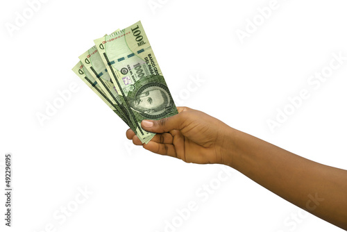 Fair hand holding 3D rendered 100000 Paraguayan guarani notes isolated on white background photo