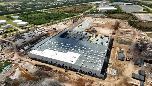 Drone aerial footage distribution center under construction 4k 60fps orbit