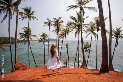 Woman in a white dress on a paradise island