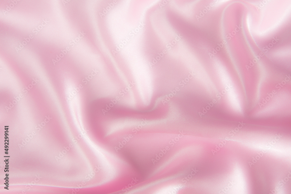 Fototapeta premium Smooth elegant pink silk or satin texture can use as abstract background.
