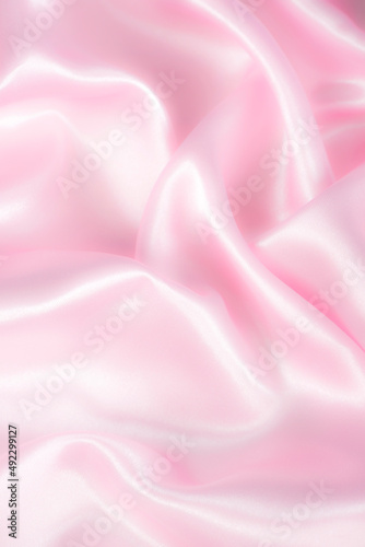 Smooth elegant pink silk or satin texture can use as abstract background.