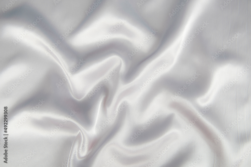 Obraz premium Abstract gray silk fabric texture background. Cloth soft wave. Creases of satin