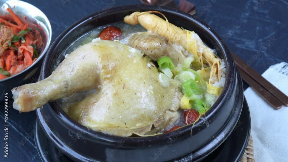 Ginseng chicken soup or Samgyetang, Koreans traditional food chicken stuffed with rice, ginsenga popular stamina food in summer. Ginseng chicken soup or Samgyetang, Koreans traditional food chicken stuffed with rice, ginsenga popular stamina food in summer.