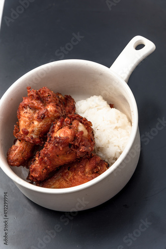 Fried chicken, steamed rice, Asian street food, on background