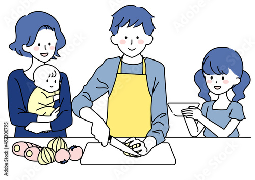 料理をする男性とお手伝いする家族