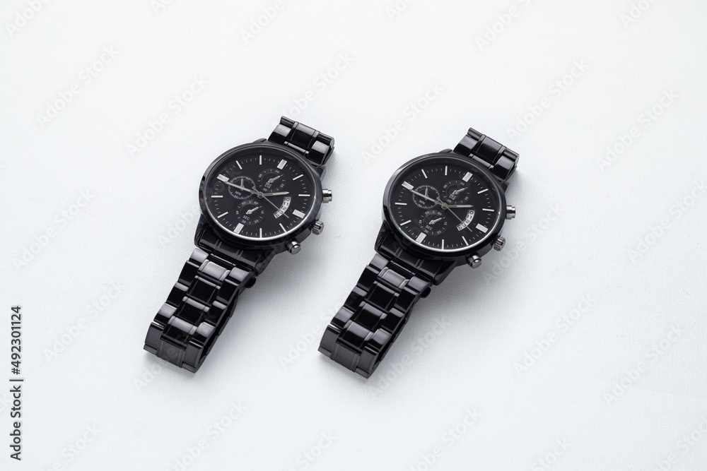 Luxury blacks watches on white Table, white board. Business man accessories Luxury blacks watches on white Table, white board. Business man accessories