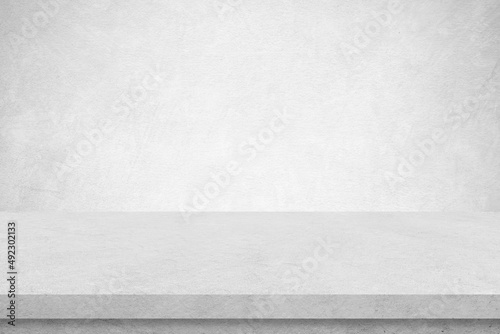 Empty white cement table over white cement concrete wall background, banner, table top, shelf, counter design for product display montage