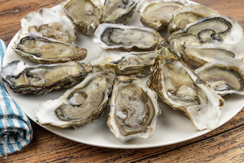 top view of a covered oyster platter on a wooden table