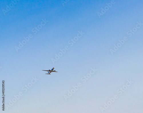 Shot of an airplane on blue sky background. Aviation